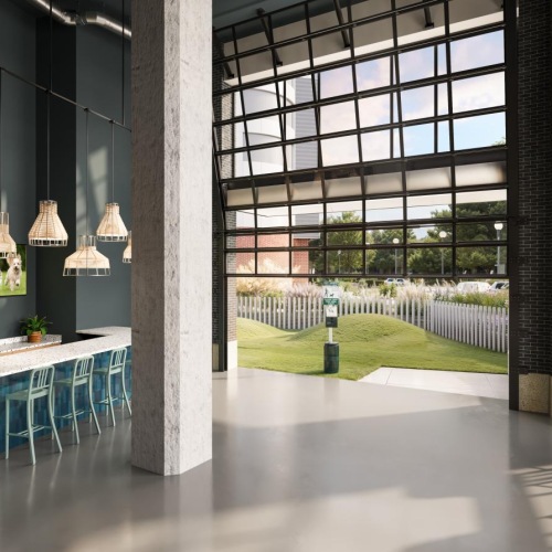 mulit-use lounge area with TVs and easy access to outdoor lawn